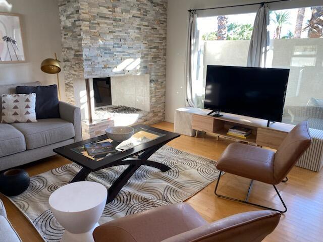 living room featuring a fireplace and hardwood / wood-style floors