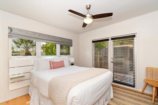 bedroom with ceiling fan and light hardwood / wood-style floors