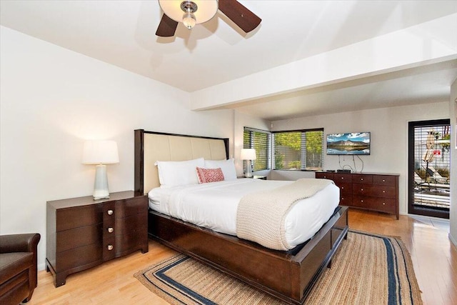 bedroom featuring light wood-type flooring, multiple windows, and ceiling fan