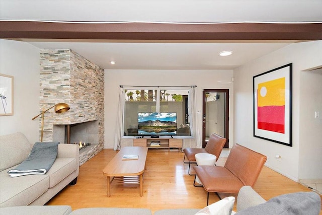 living room with a fireplace and light hardwood / wood-style floors