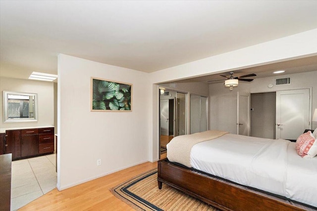 bedroom featuring light wood-type flooring and ceiling fan