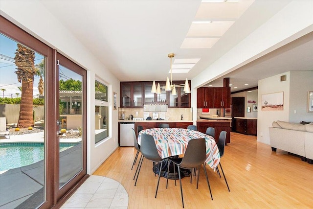 dining area with light hardwood / wood-style floors