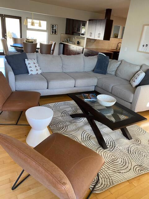 living room with french doors and light hardwood / wood-style floors