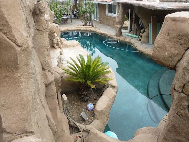 view of swimming pool with a patio