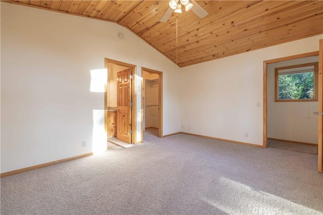 interior space featuring light carpet, vaulted ceiling, ceiling fan, and wooden ceiling