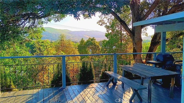 wooden terrace with a mountain view