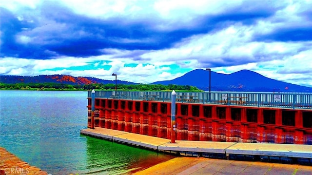 dock area with a water and mountain view