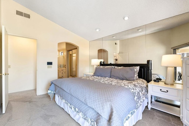 carpeted bedroom featuring vaulted ceiling