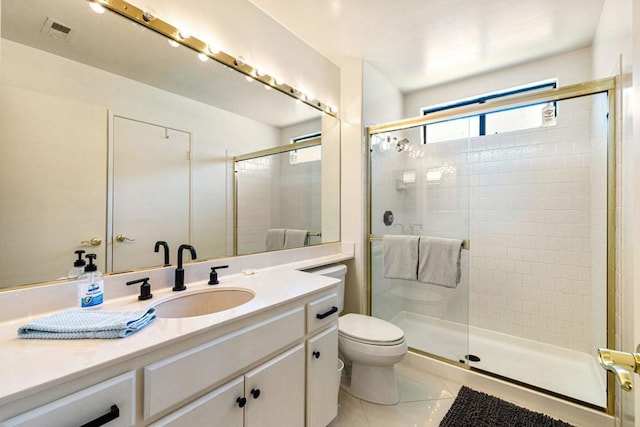 bathroom with an enclosed shower, vanity, toilet, and tile patterned flooring