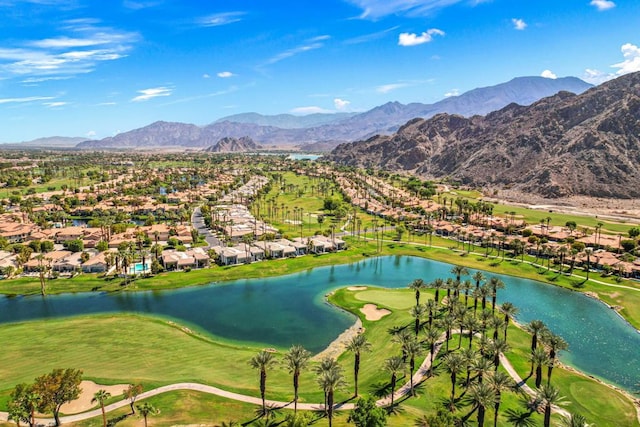 drone / aerial view with a water and mountain view