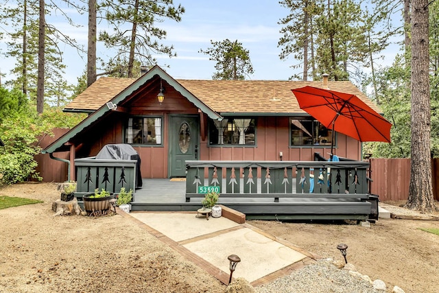 view of front of property featuring a wooden deck