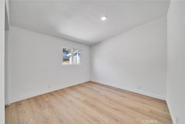 unfurnished room with light hardwood / wood-style flooring