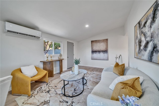 living room with lofted ceiling, an AC wall unit, and light hardwood / wood-style flooring