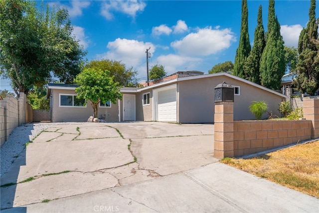 single story home featuring a garage