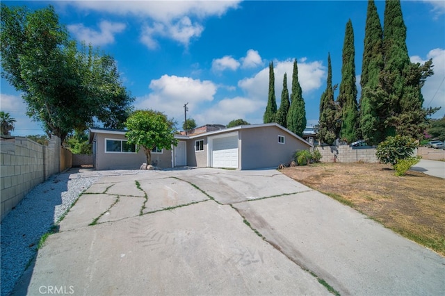 ranch-style house featuring a garage