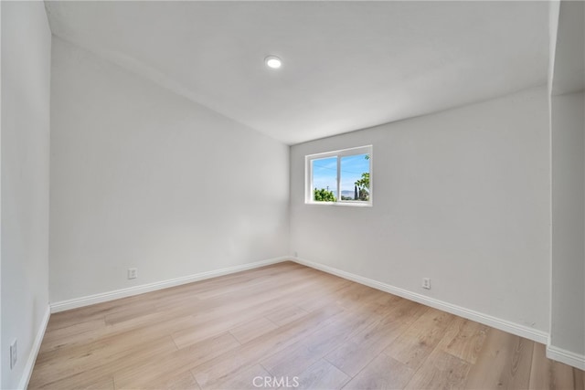 spare room with light wood-type flooring