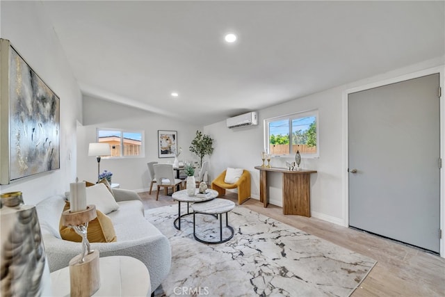 living room with light hardwood / wood-style floors, a wall mounted air conditioner, and lofted ceiling