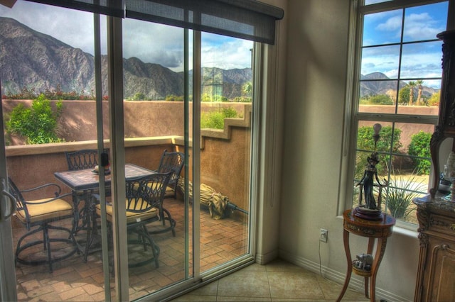 sunroom featuring a mountain view