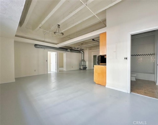 garage featuring black fridge