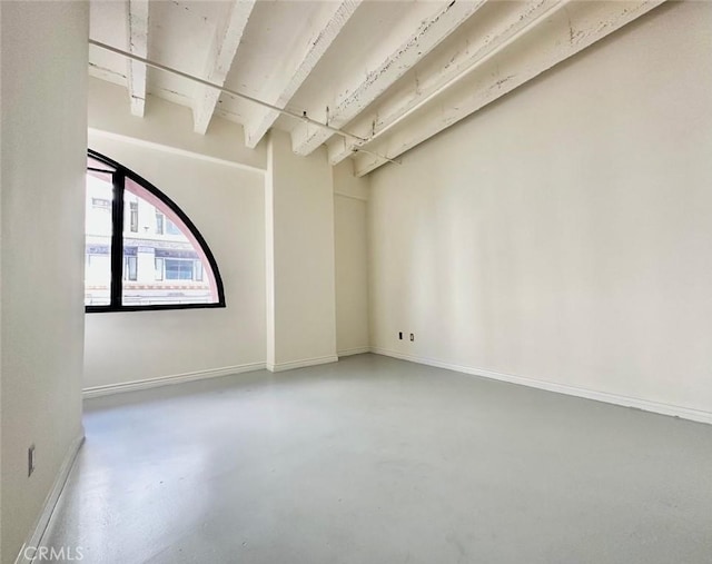 unfurnished room with concrete floors