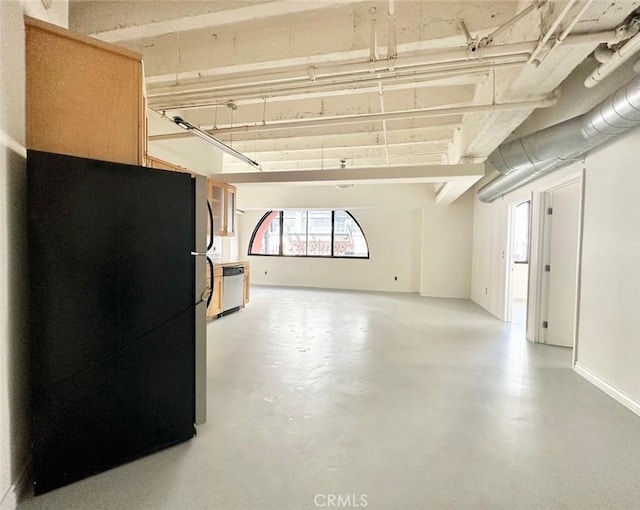 garage with black fridge