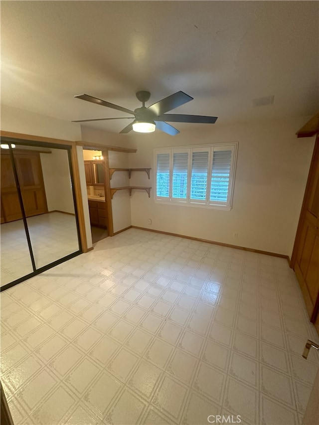 unfurnished bedroom featuring a closet and ceiling fan