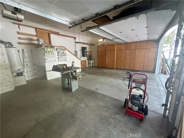 garage featuring a garage door opener and gas water heater