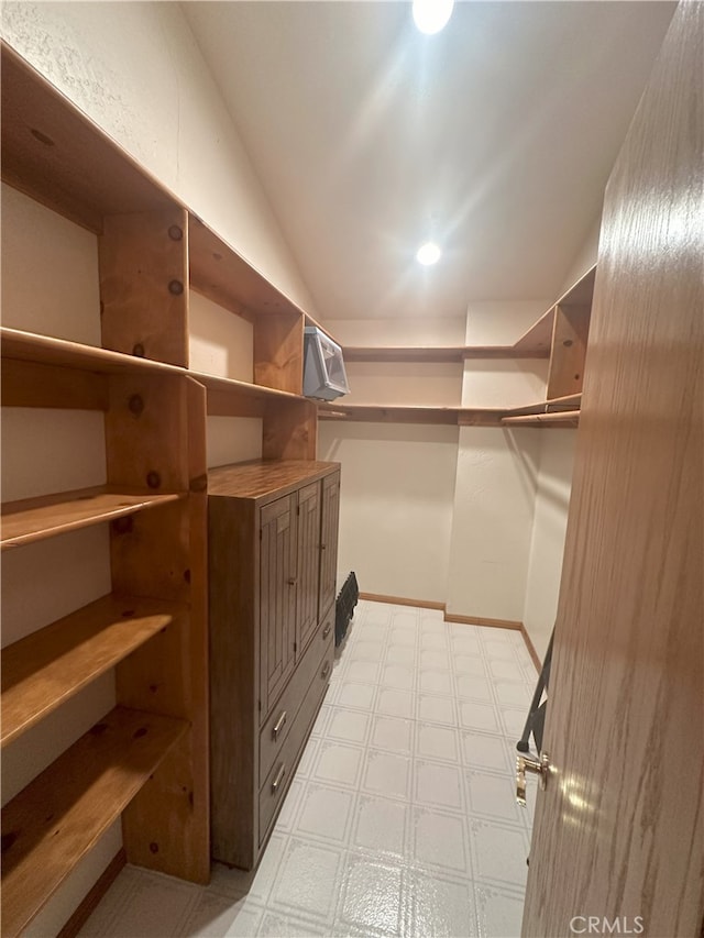 spacious closet with lofted ceiling