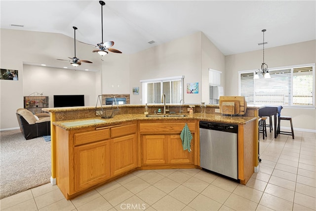 kitchen with stainless steel dishwasher, light tile patterned flooring, sink, and ceiling fan