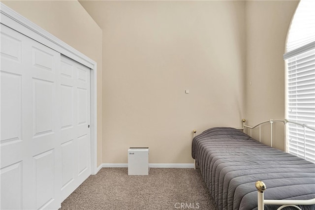 carpeted bedroom featuring a closet