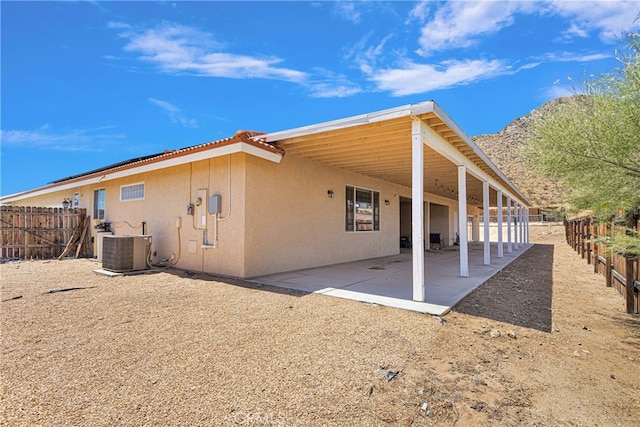 back of house with a patio and central air condition unit