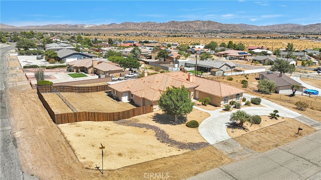 birds eye view of property with a mountain view