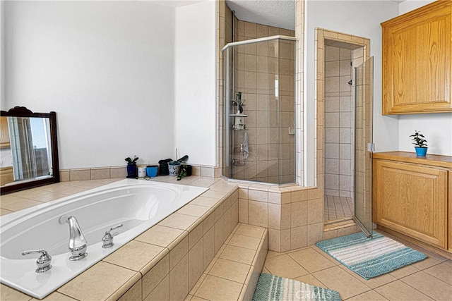 bathroom with independent shower and bath and tile patterned floors