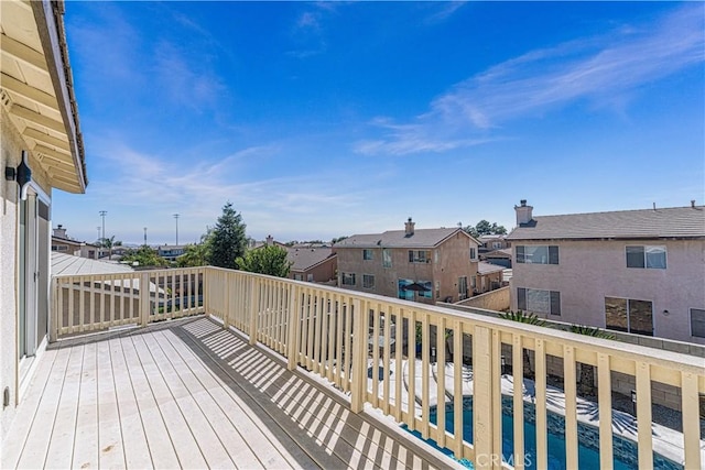 wooden deck featuring a residential view