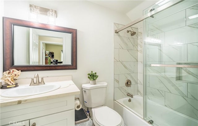 full bathroom with toilet, combined bath / shower with glass door, and vanity