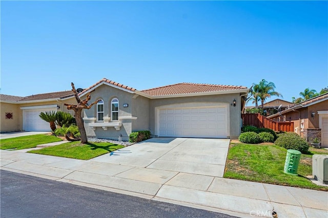 view of front of home with a garage and a front yard