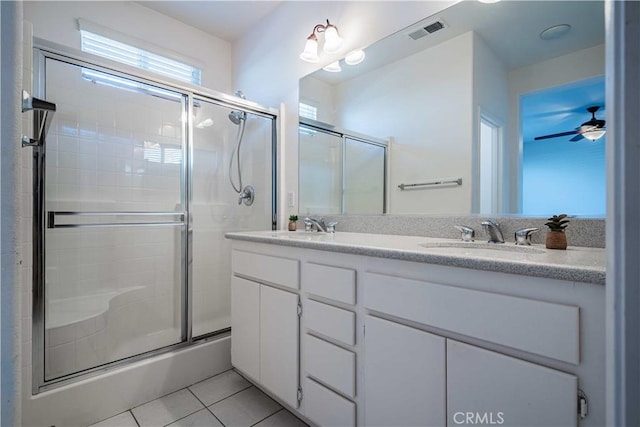 bathroom with vanity, tile patterned floors, a shower with door, and ceiling fan