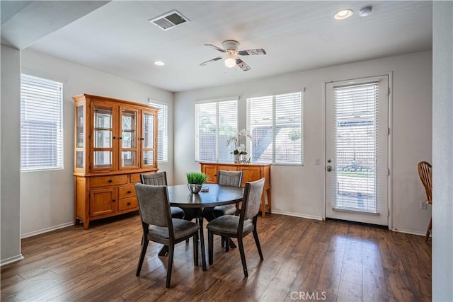 dining space featuring ceiling fan and dark hardwood / wood-style flooring