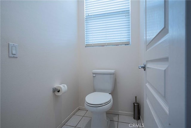 bathroom featuring toilet and tile patterned floors