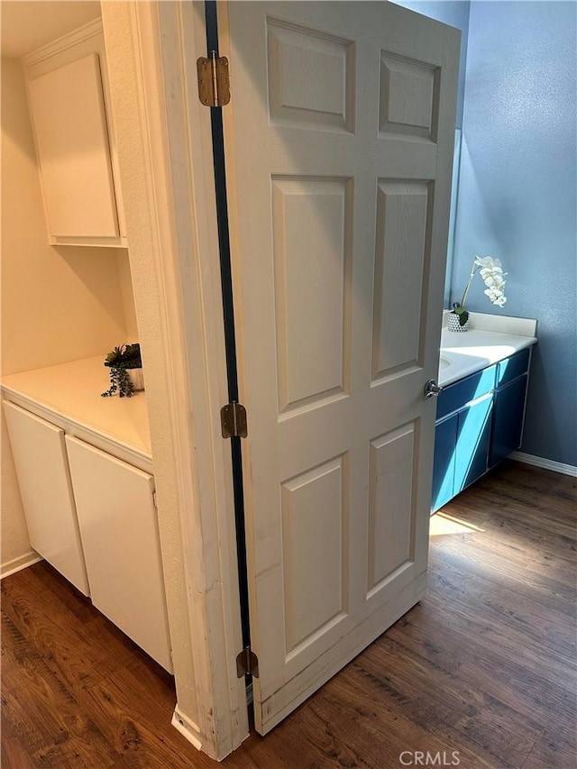 bathroom with hardwood / wood-style flooring