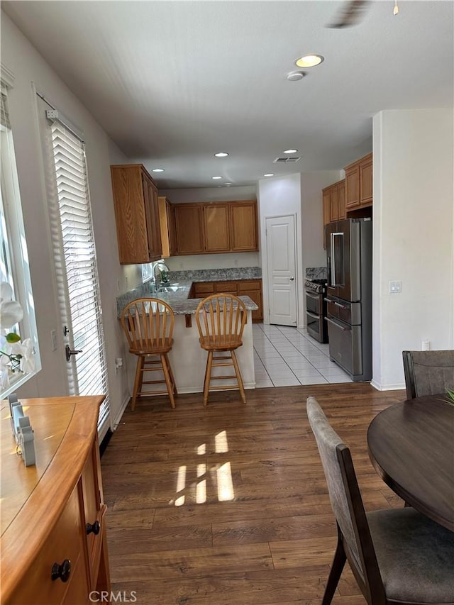 dining room featuring light hardwood / wood-style flooring and sink