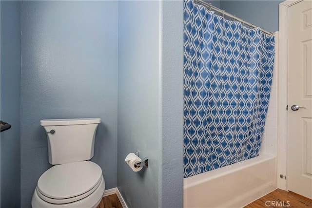 bathroom featuring shower / bath combo, toilet, and wood-type flooring