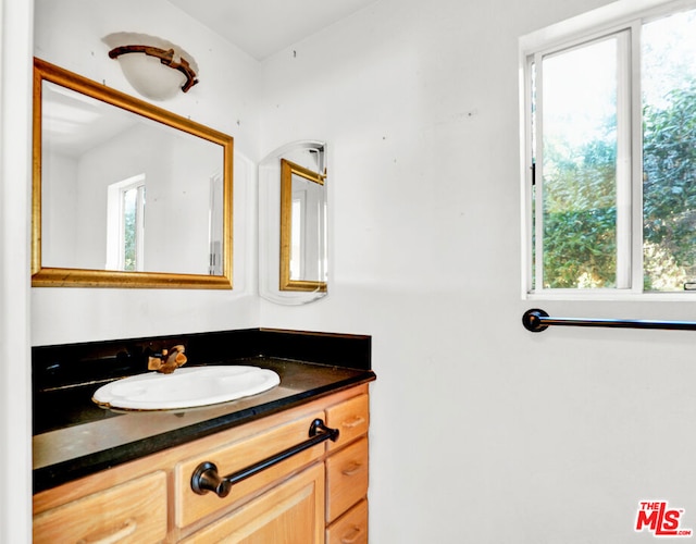 bathroom with vanity and a healthy amount of sunlight