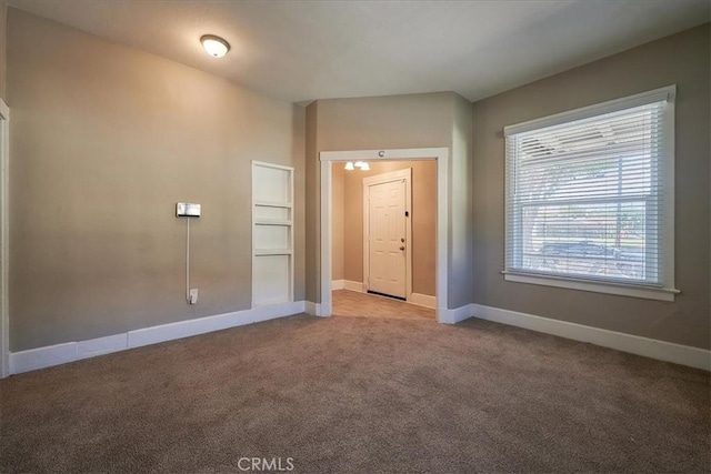 empty room featuring light carpet