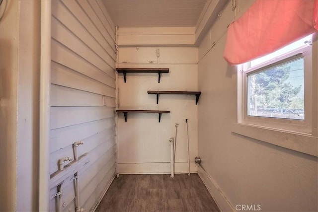 laundry room with dark hardwood / wood-style floors