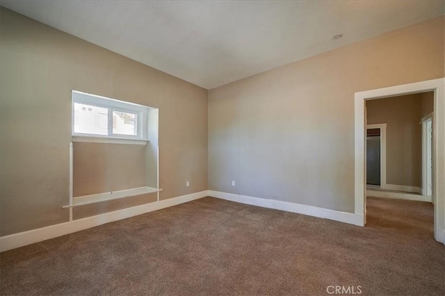 spare room featuring carpet floors