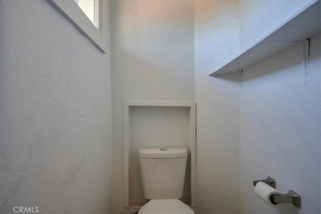 bathroom featuring toilet