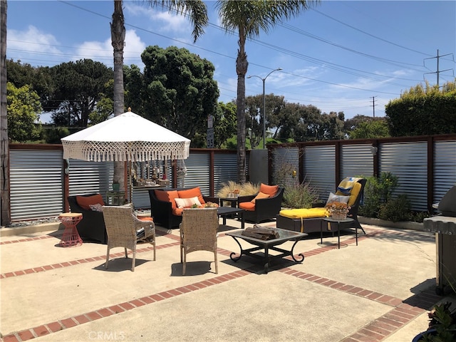 view of patio / terrace with an outdoor living space and a gazebo