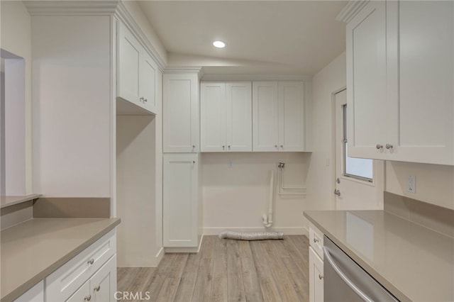 kitchen featuring light hardwood / wood-style floors and white cabinets