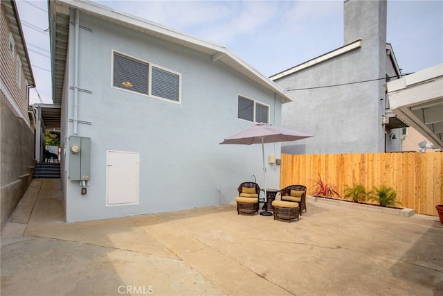 back of house with a patio